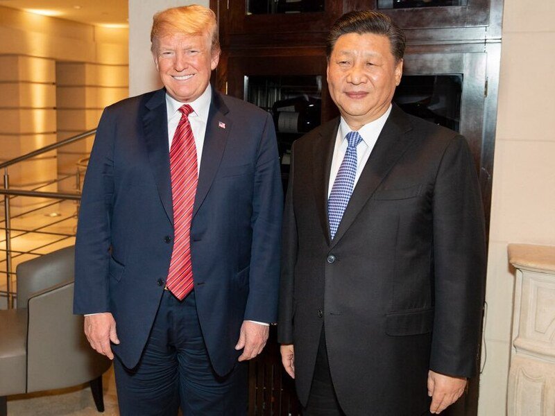 Donald Trump junto a Xi Jinping